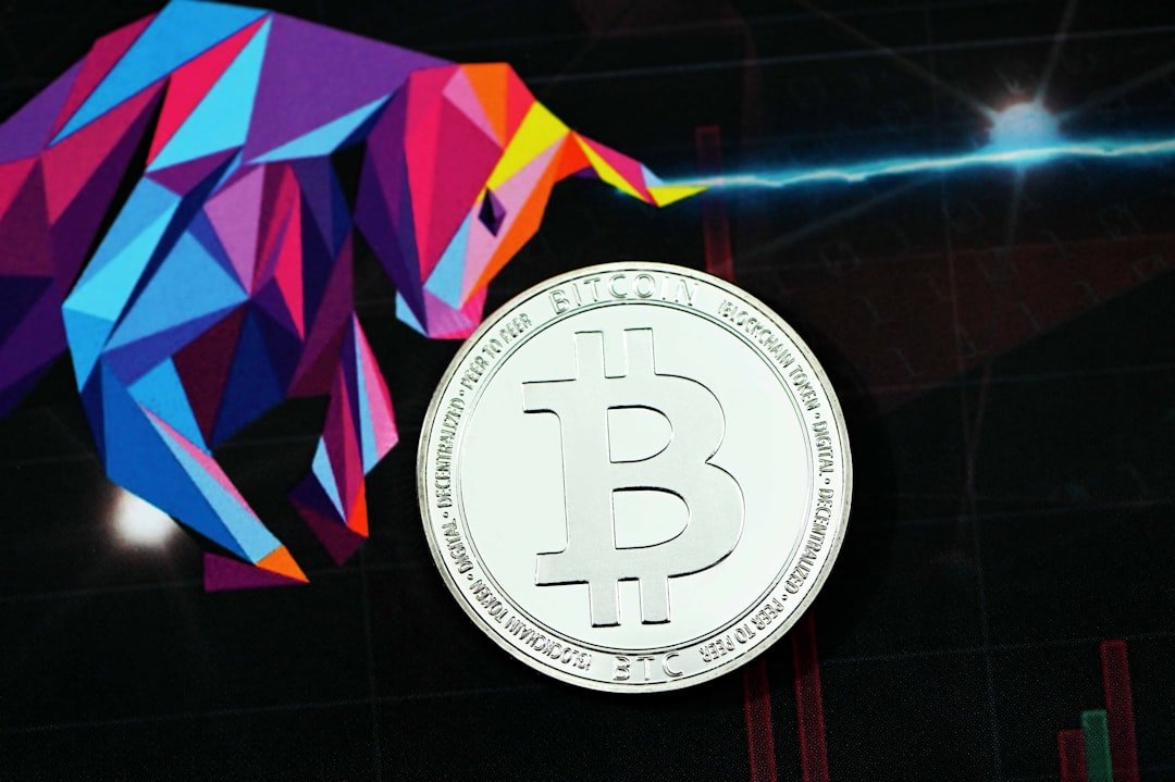 A bitcoin placed on an executium logo